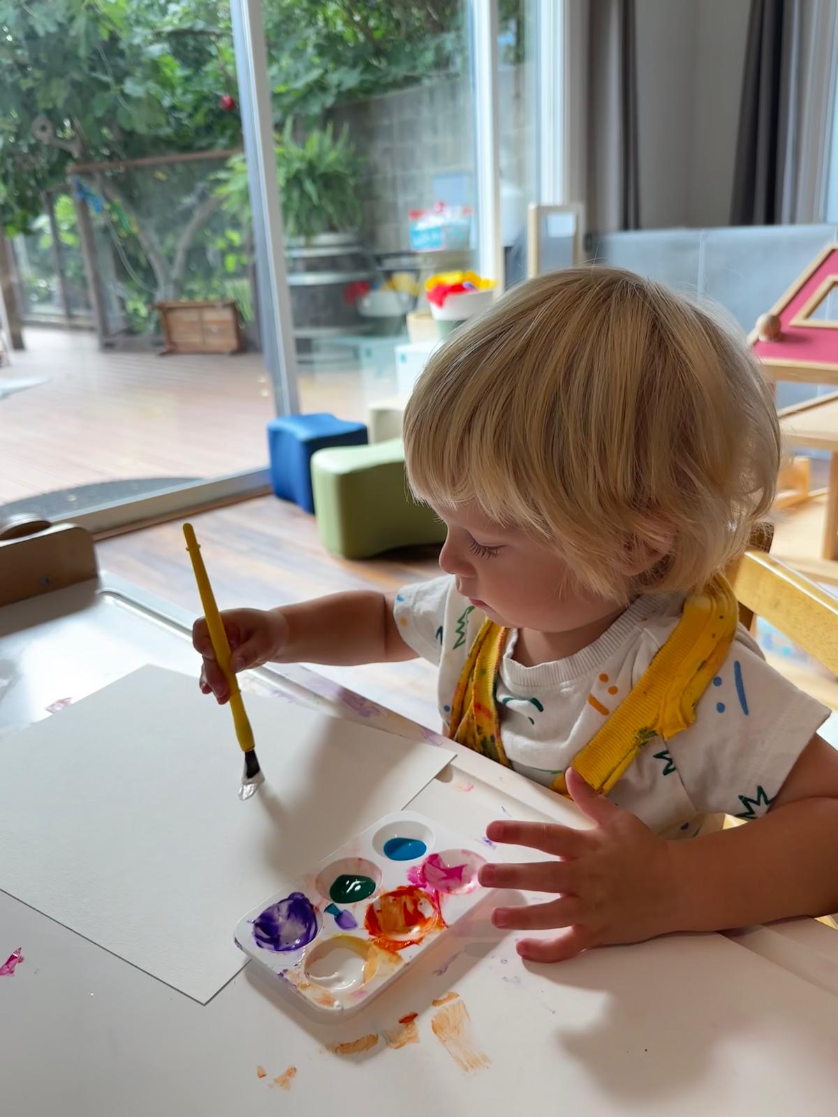 Toddler painting with watercolors